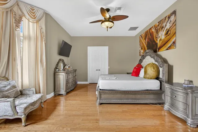 a view of a patio with table and chairs and potted plants