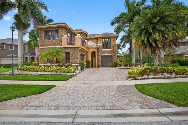 a view of a house with swimming pool and a garden