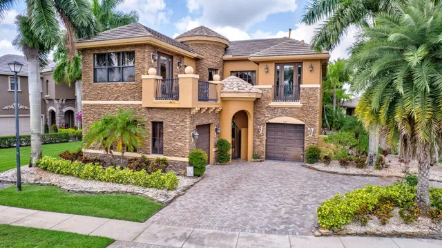 an aerial view of a house with garden space and street view