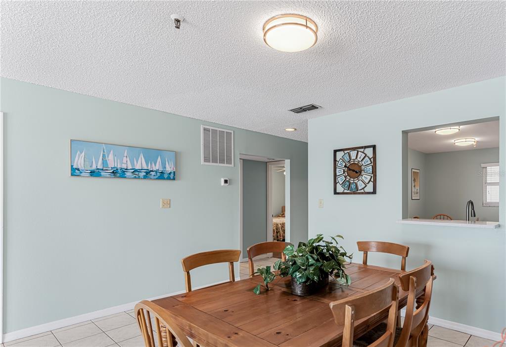 13500 Gulf Boulevard, Unit 602 Madeira Beach, FL 33708 - Photo 12 of 34 a view of a dining room with furniture
