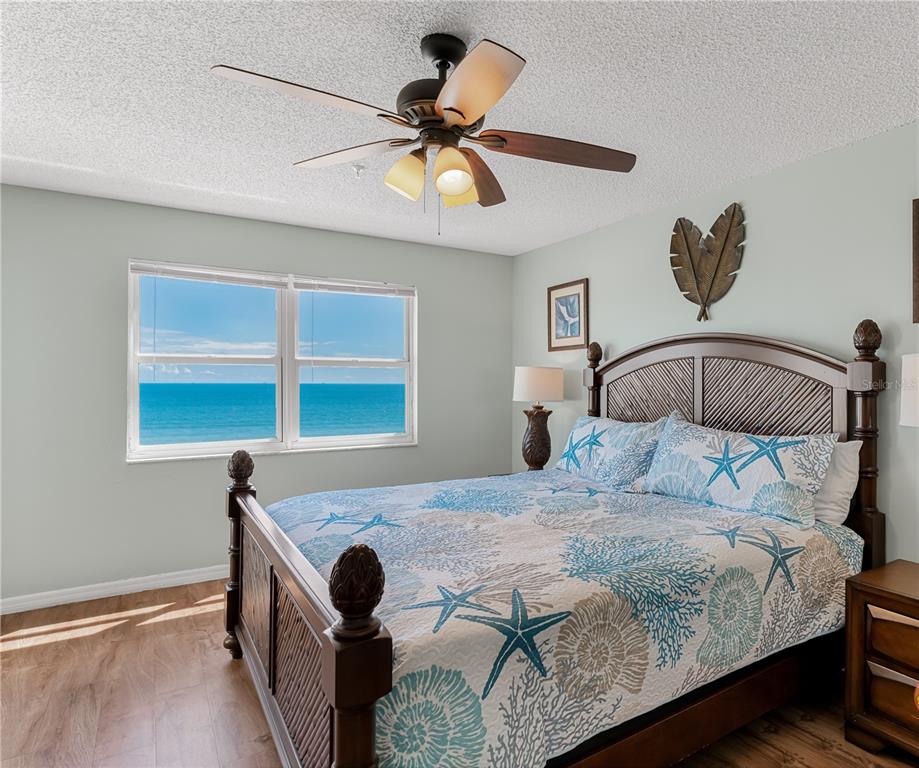 13500 Gulf Boulevard, Unit 602 Madeira Beach, FL 33708 - Photo 17 of 34 a bedroom with a bed and window