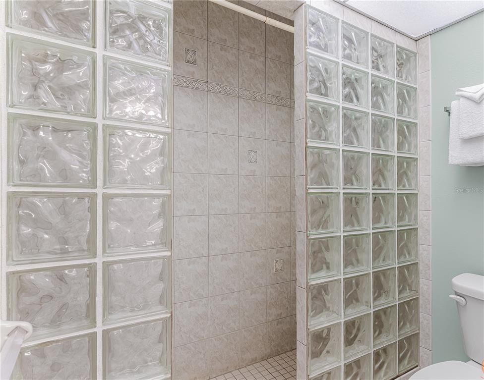 13500 Gulf Boulevard, Unit 602 Madeira Beach, FL 33708 - Photo 22 of 34 a view of a room with windows and shelf