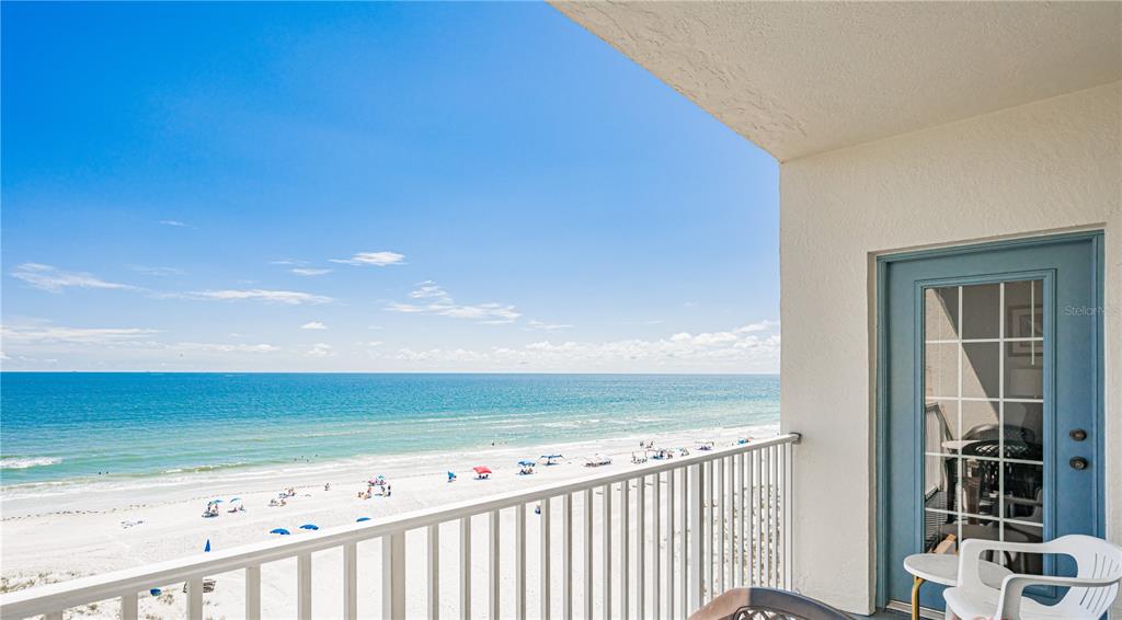 13500 Gulf Boulevard, Unit 602 Madeira Beach, FL 33708 - Photo 5 of 34 a view of an ocean from a balcony