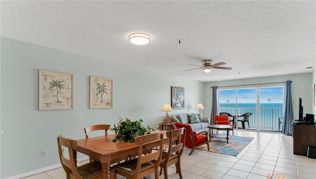 13500 Gulf Boulevard, Unit 602 Madeira Beach, FL 33708 - Photo 10 of 34 a living room with furniture and a potted plant