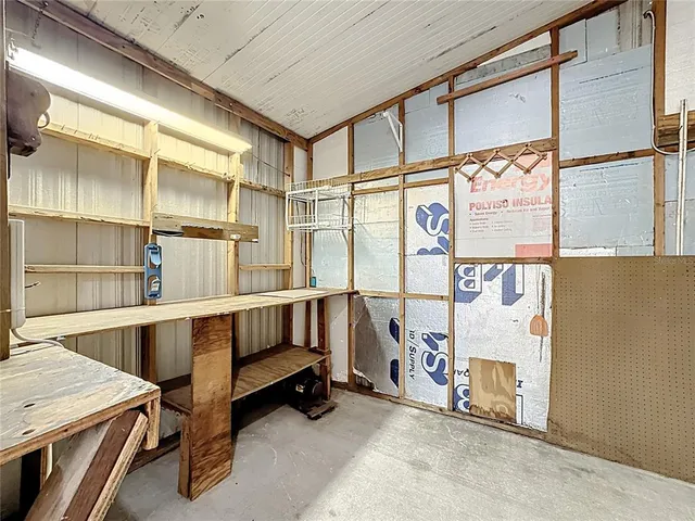 a utility room with multiple dryer and washer