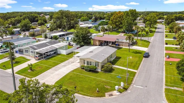 an aerial view of a house with a swimming pool