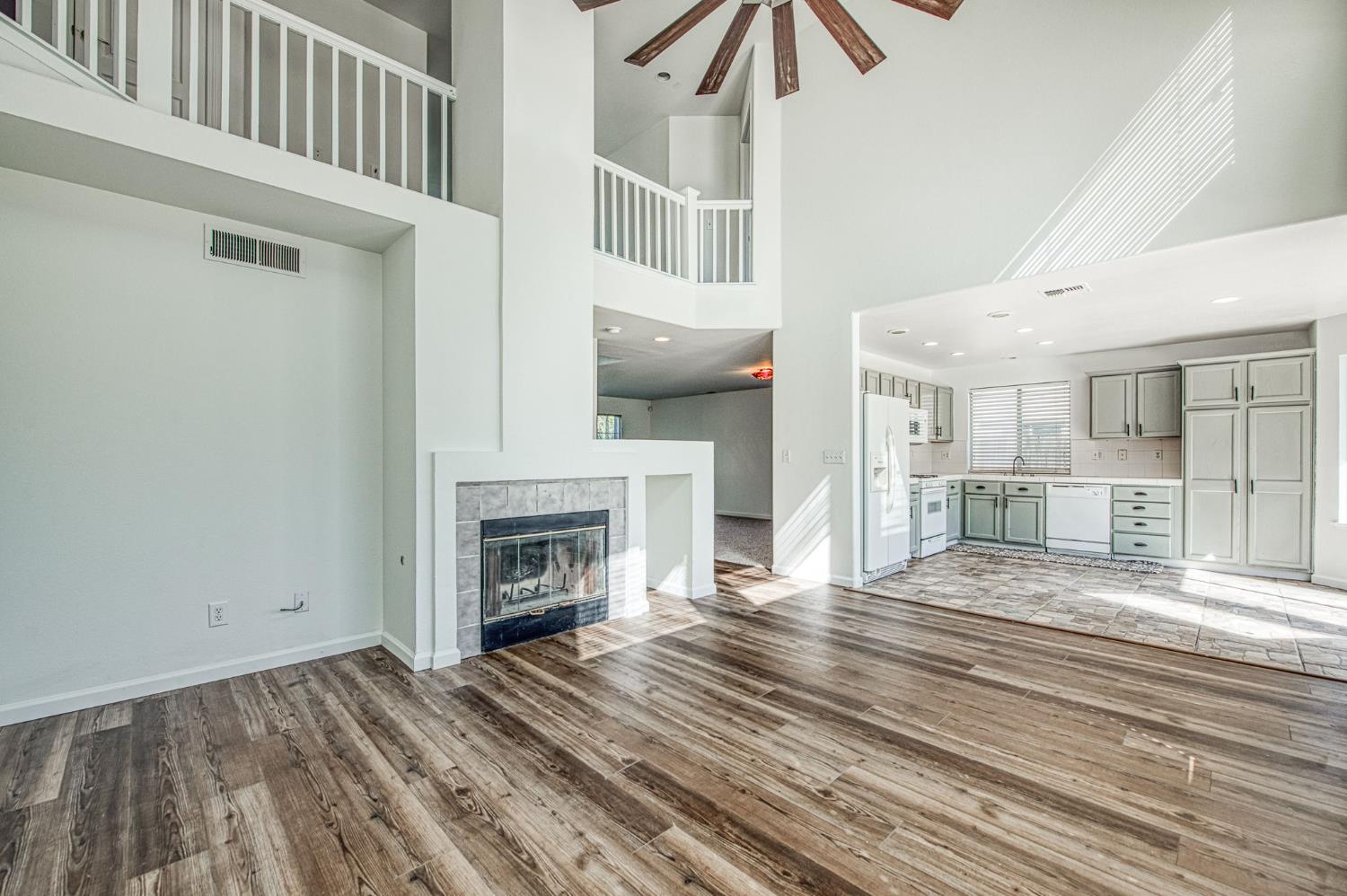 2836 Griffith Avenue Clovis, CA 93611 - Photo 11 of 41 a view of a livingroom with wooden floor and a fireplace