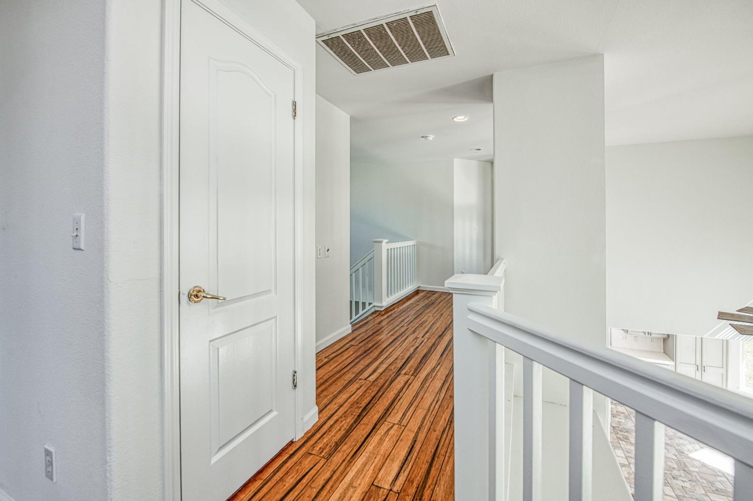 2836 Griffith Avenue Clovis, CA 93611 - Photo 20 of 41 a view of a hallway with wooden floor and staircase