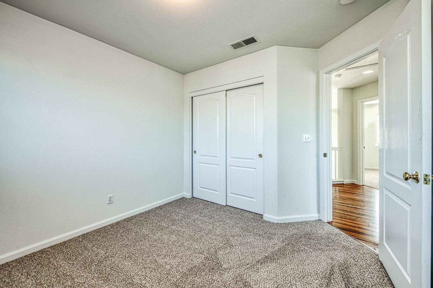 2836 Griffith Avenue Clovis, CA 93611 - Photo 28 of 41 wooden floor and closet in a room