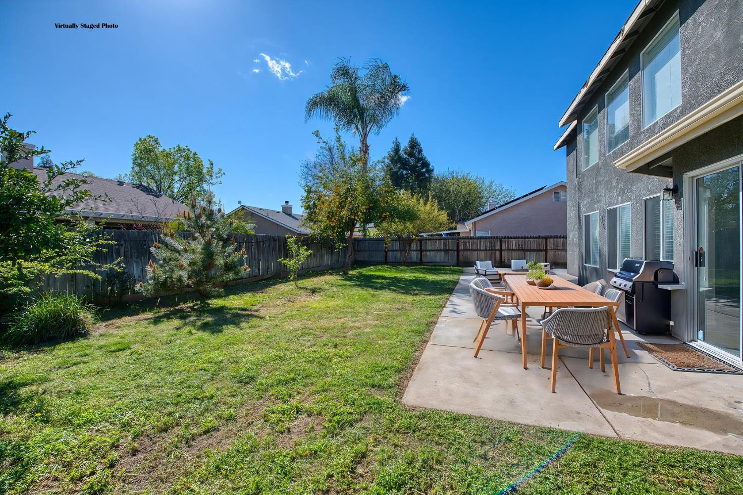2836 Griffith Avenue Clovis, CA 93611 - Photo 33 of 41 a backyard of a house with table and chairs