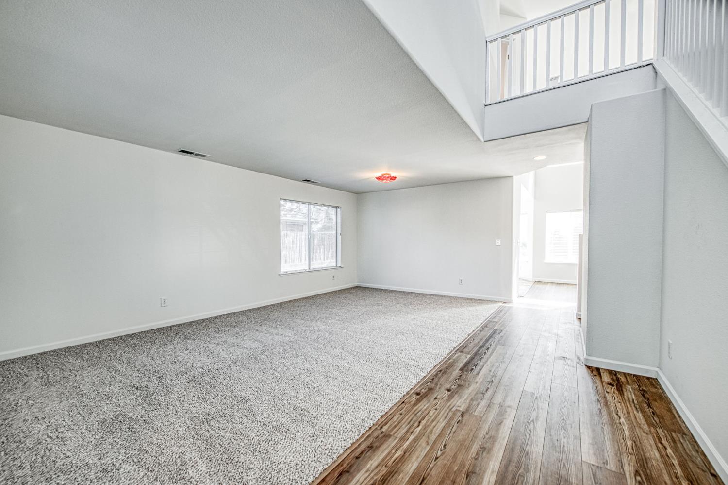 2836 Griffith Avenue Clovis, CA 93611 - Photo 7 of 41 a view of empty room with wooden floor