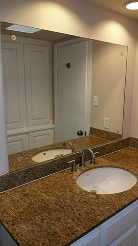 a bathroom with a sink and a mirror