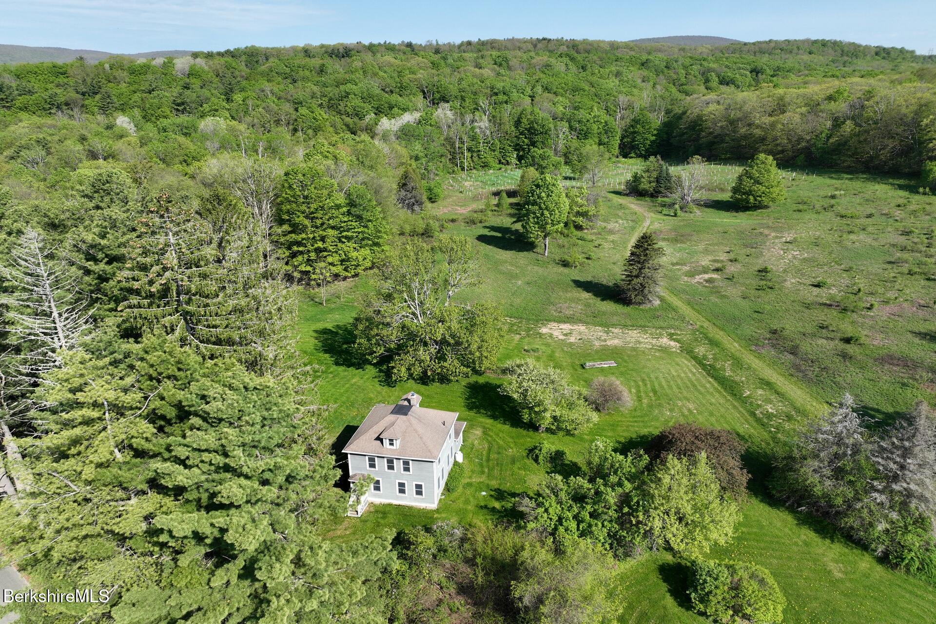 86 Miner Road Lanesborough, MA 01237 - Photo 16 of 44 a view of a lush green field