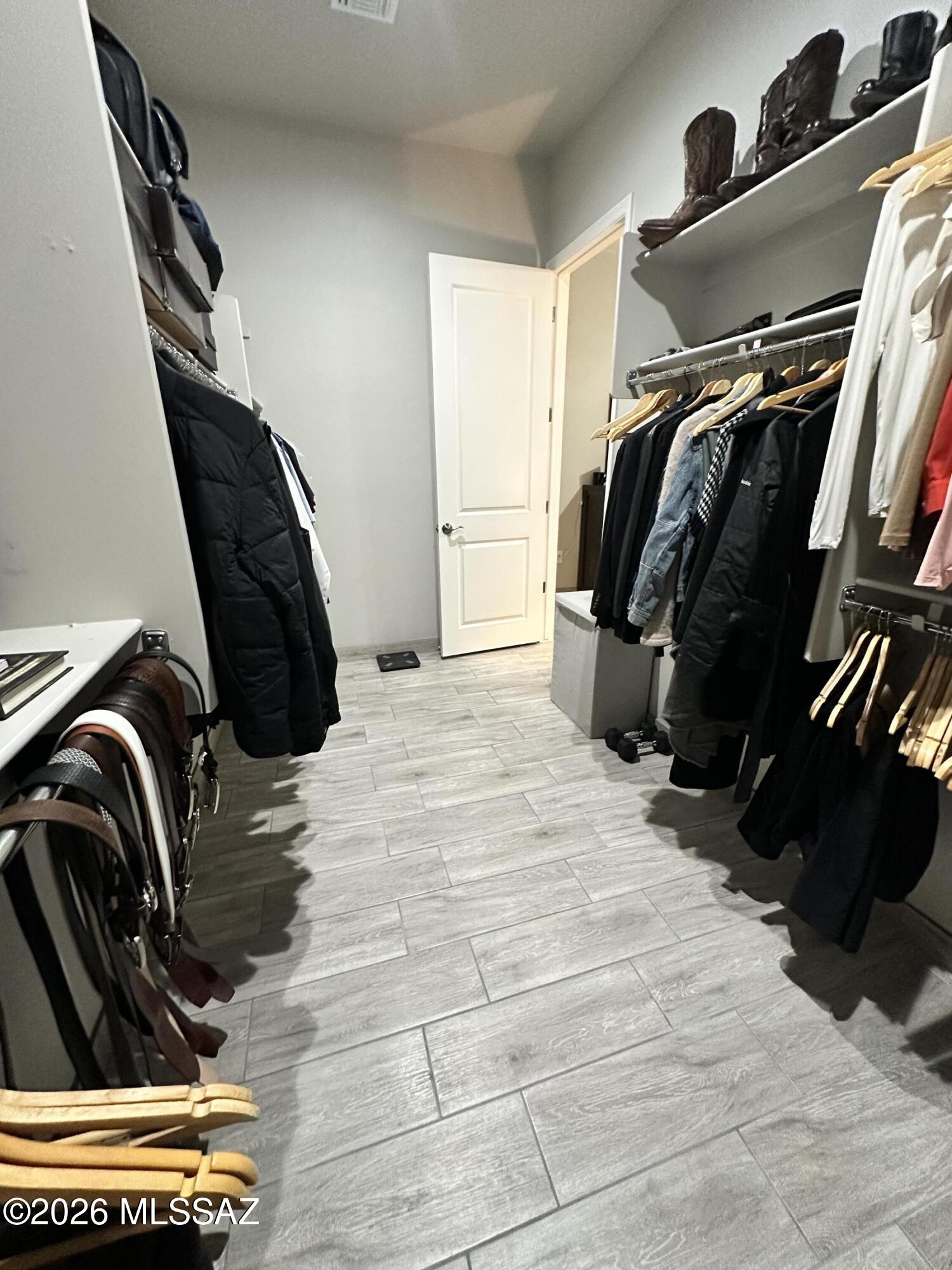 117 Ver Patria Rio Rico, AZ 85648 - Photo 21 of 28 a view of walk in closet with clothes and shoes