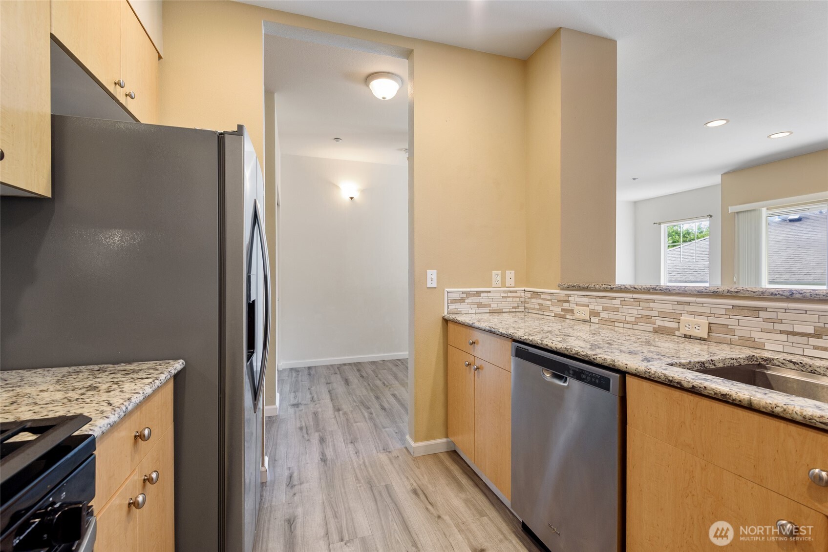 5001 Davis Place South, Unit A Renton, WA 98055 - Photo 11 of 24 a bathroom with a granite countertop sink and a mirror