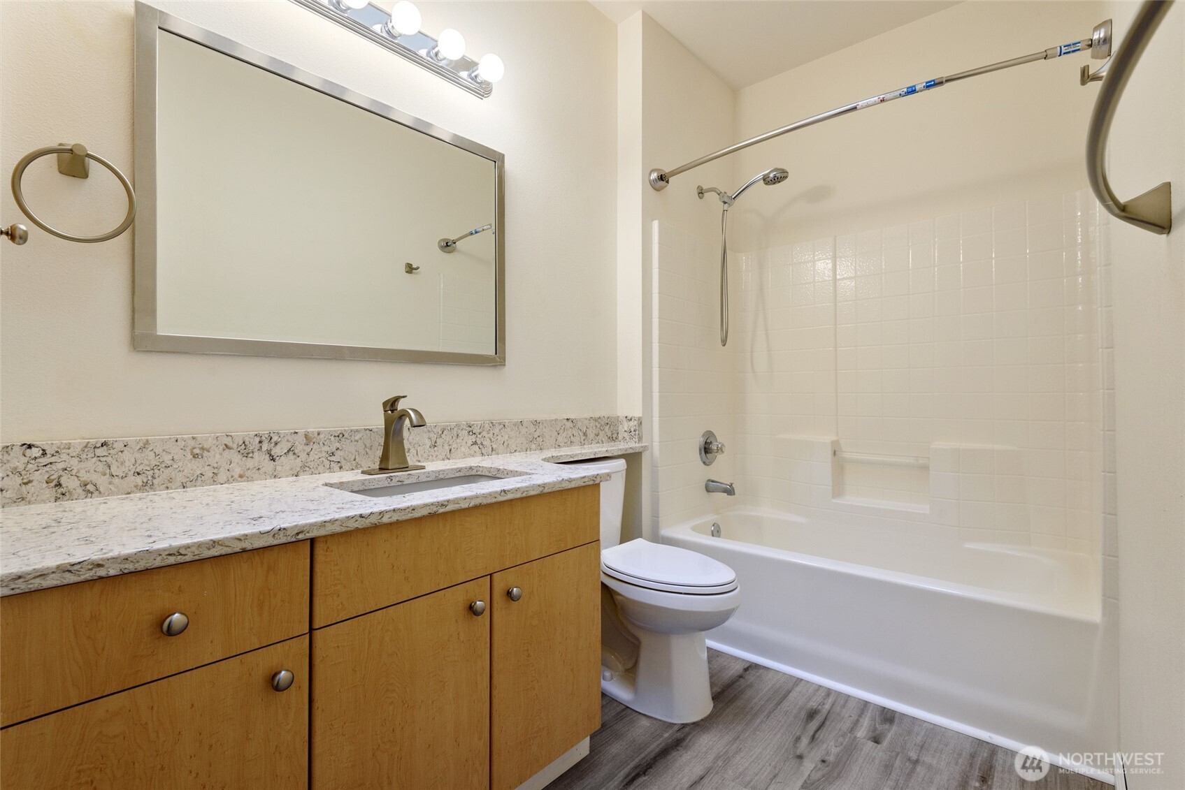 5001 Davis Place South, Unit A Renton, WA 98055 - Photo 17 of 24 a bathroom with a sink a toilet and a bathtub