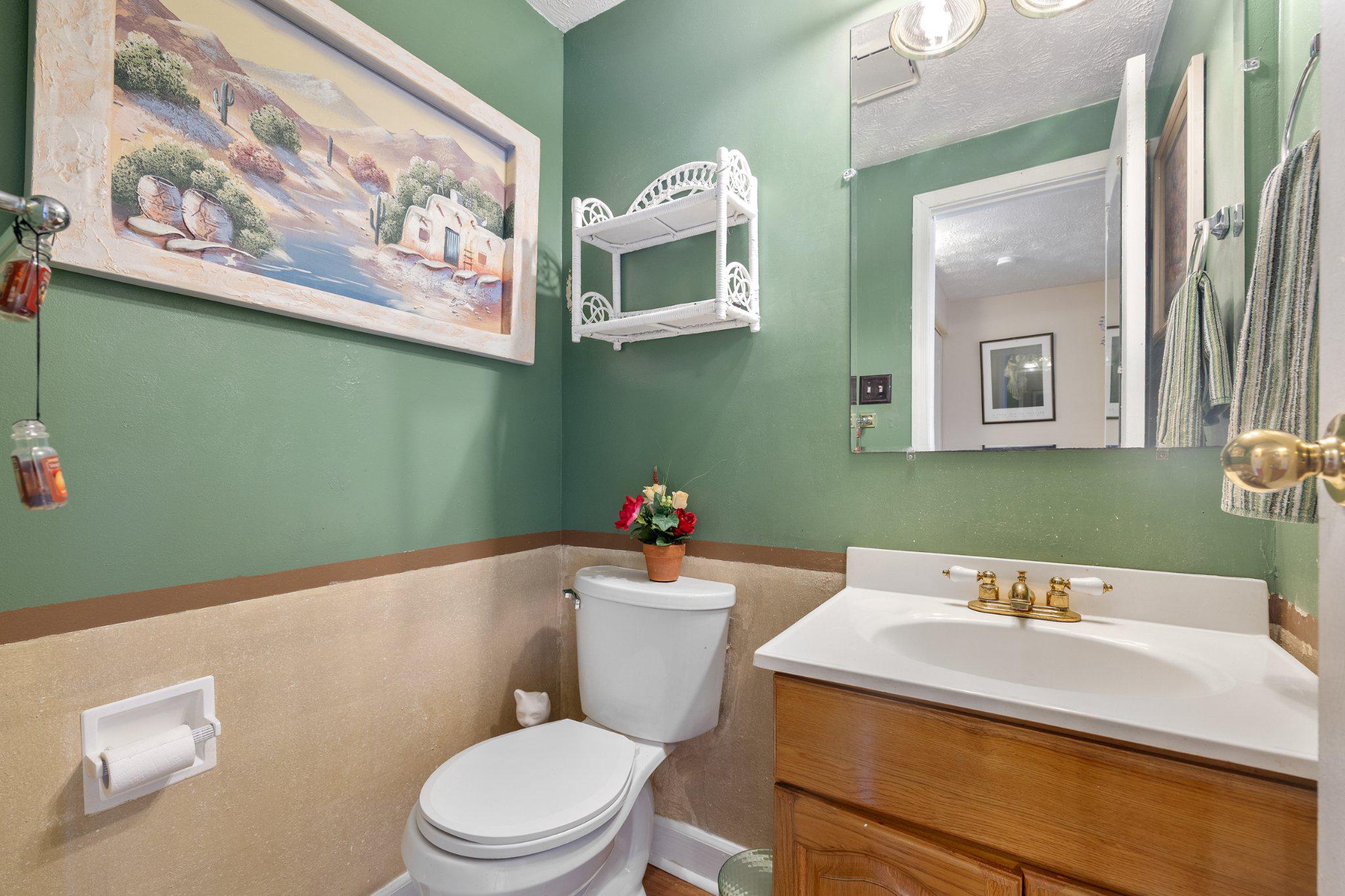 17 Morning Court Rosedale, MD 21237 - Photo 5 of 24 a white toilet sitting next to a bathroom sink