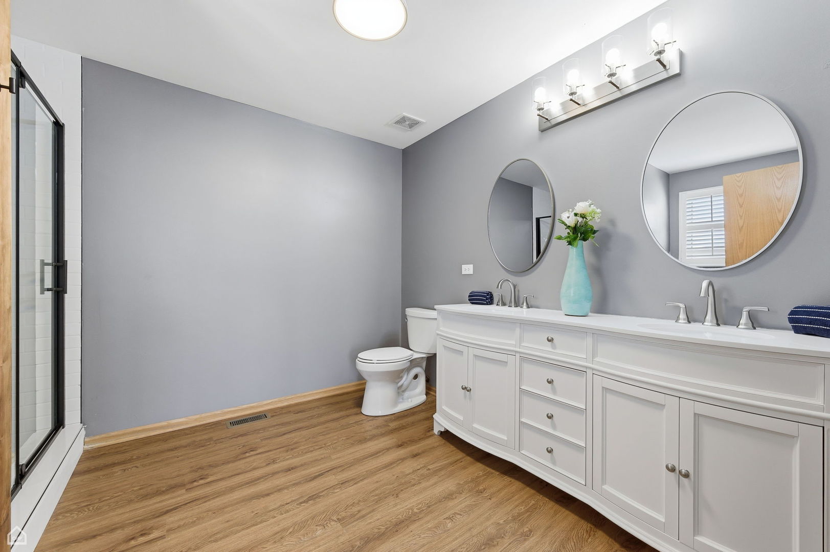 16353 Celtic Circle Manhattan, IL 60442 - Photo 11 of 23 a spacious bathroom with a double vanity sink and a mirror