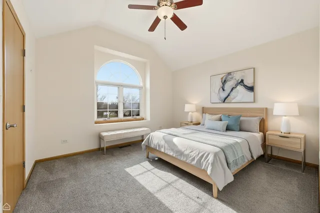 a bedroom with a bed and window