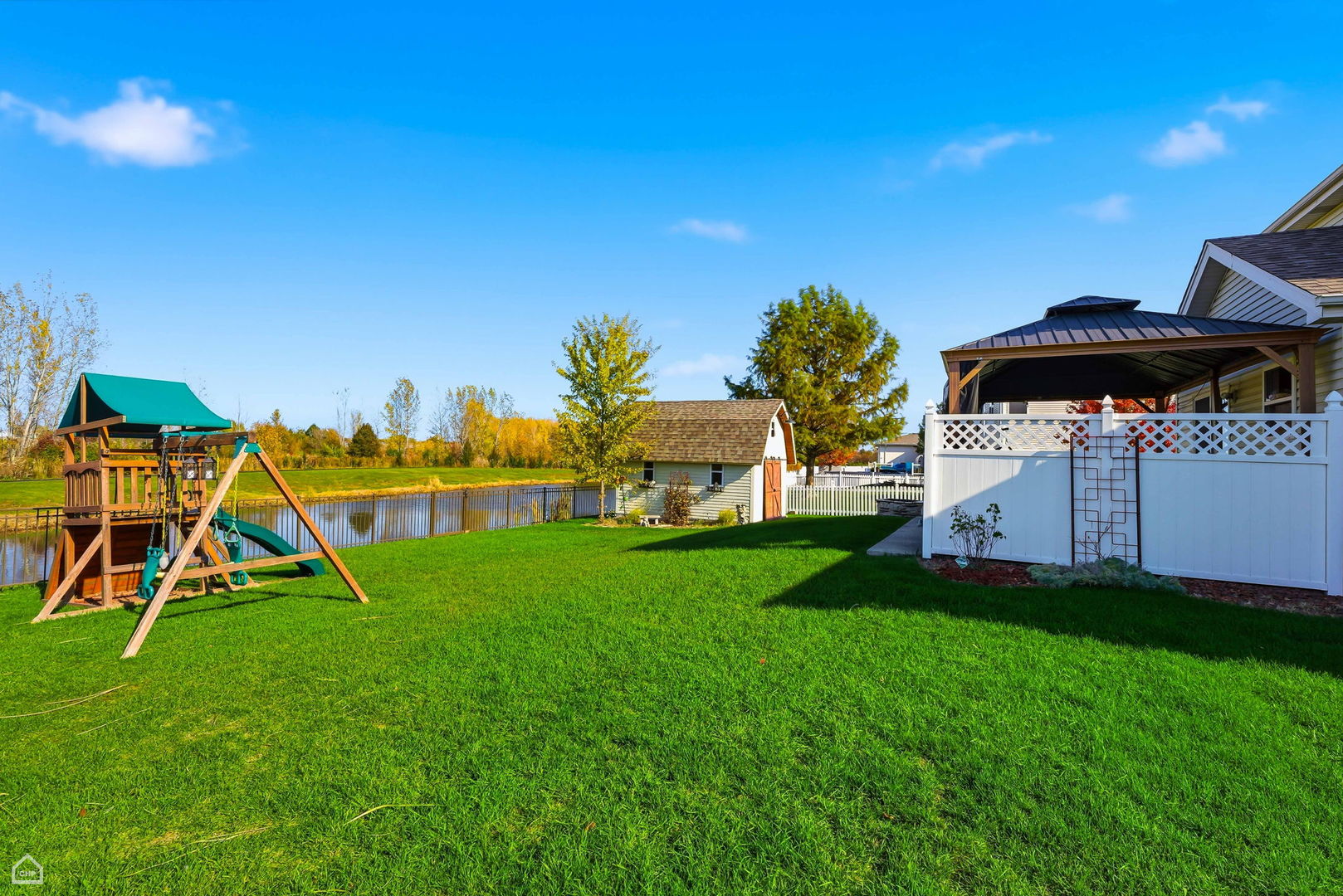 16353 Celtic Circle Manhattan, IL 60442 - Photo 19 of 23 a view of a house with a backyard and a table