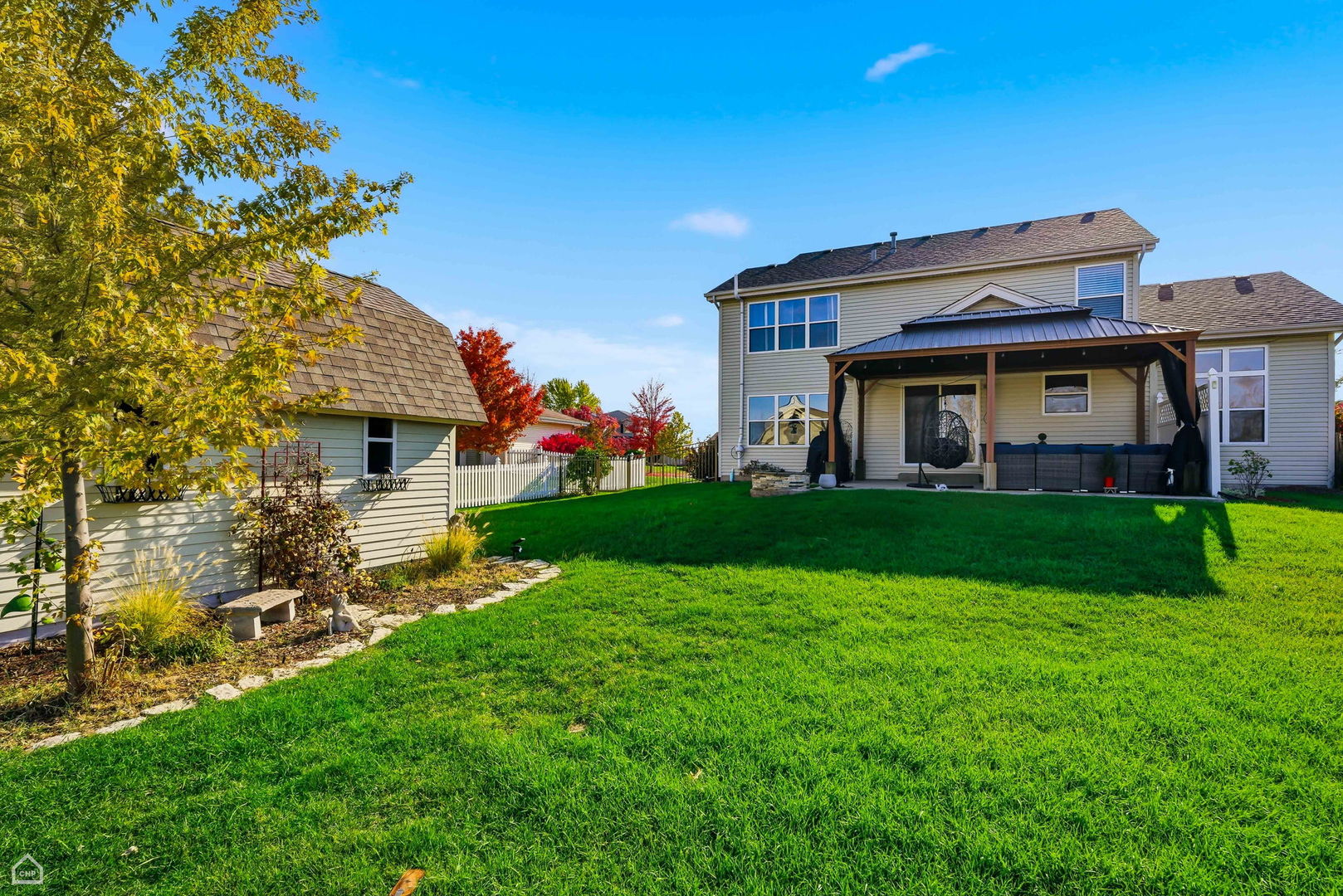16353 Celtic Circle Manhattan, IL 60442 - Photo 21 of 23 a front view of a house with garden