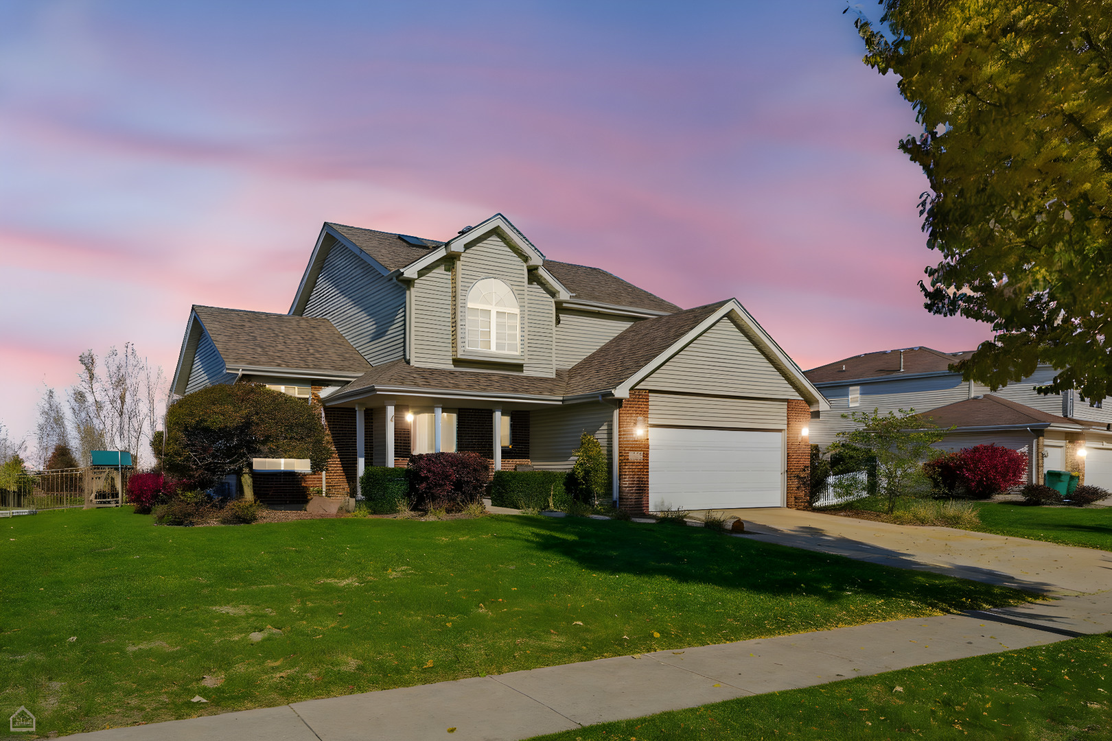 16353 Celtic Circle Manhattan, IL 60442 - Photo 23 of 23 a front view of a house with a garden and plants