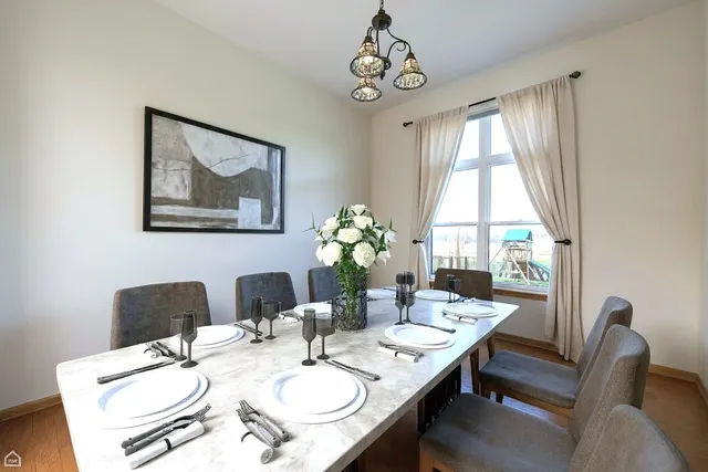 a view of a dining room with furniture window and outside view