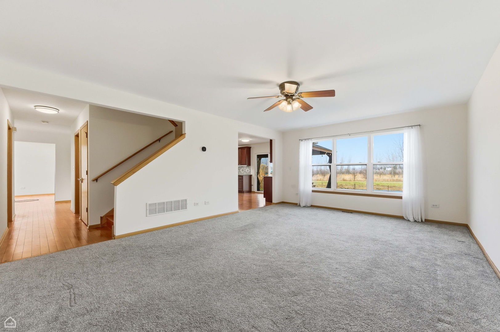 16353 Celtic Circle Manhattan, IL 60442 - Photo 8 of 23 a view of a livingroom with a ceiling fan and window