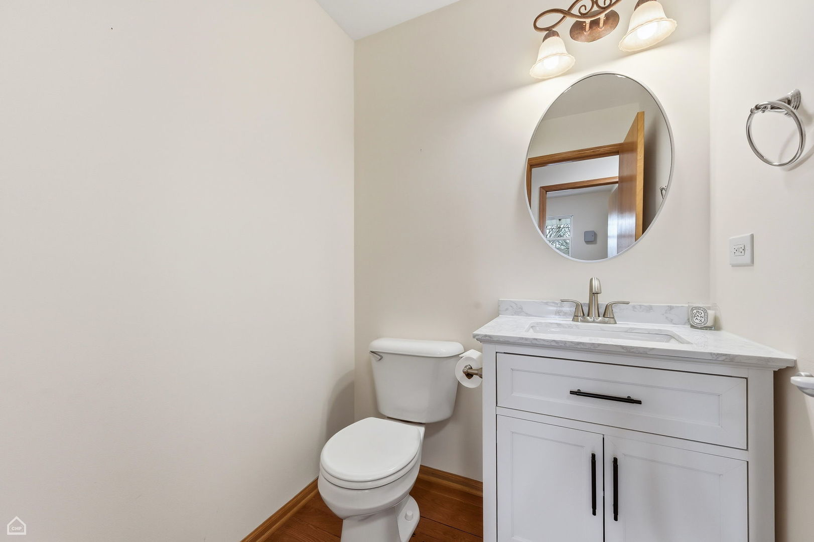 16353 Celtic Circle Manhattan, IL 60442 - Photo 9 of 23 a bathroom with a toilet a sink and a mirror