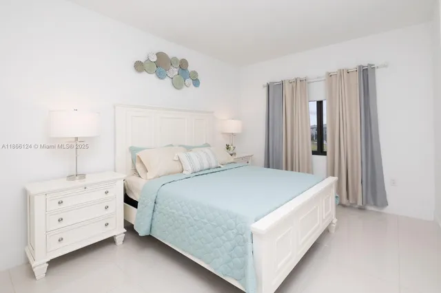 a bed room with a bed and a window