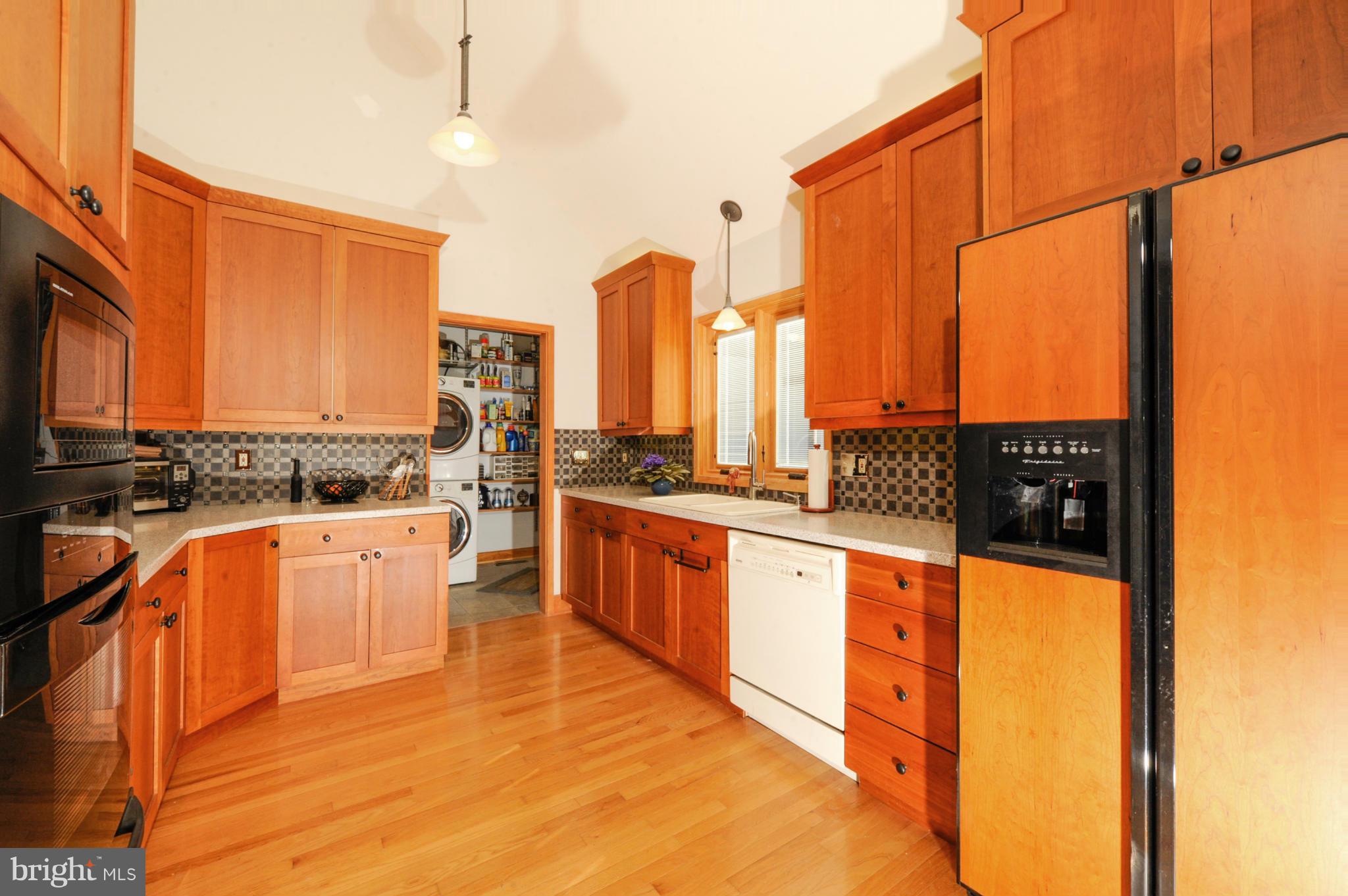 Gourmet kitchen with cherry cabinetry