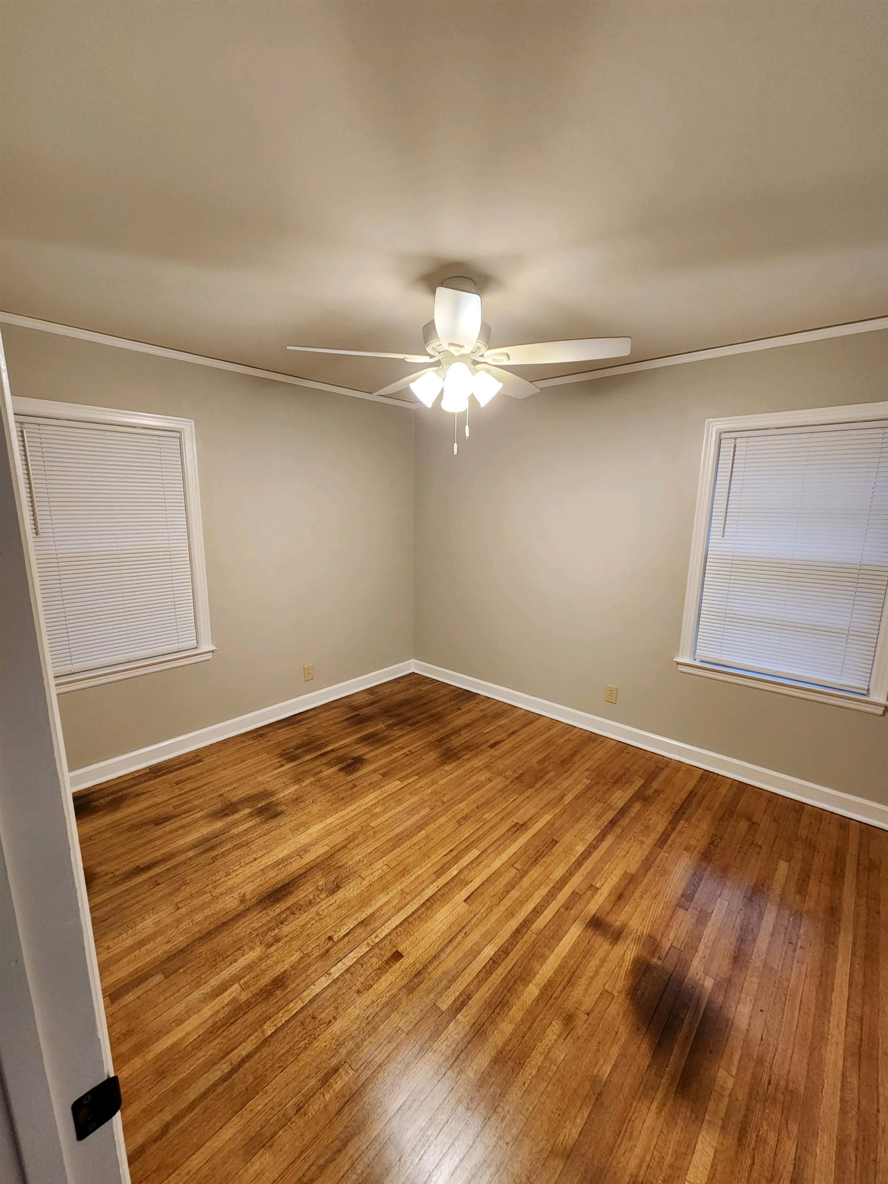 4624 Willow Road Memphis, TN 38117 - Photo 6 of 14 a view of a room with wooden floor and a ceiling fan