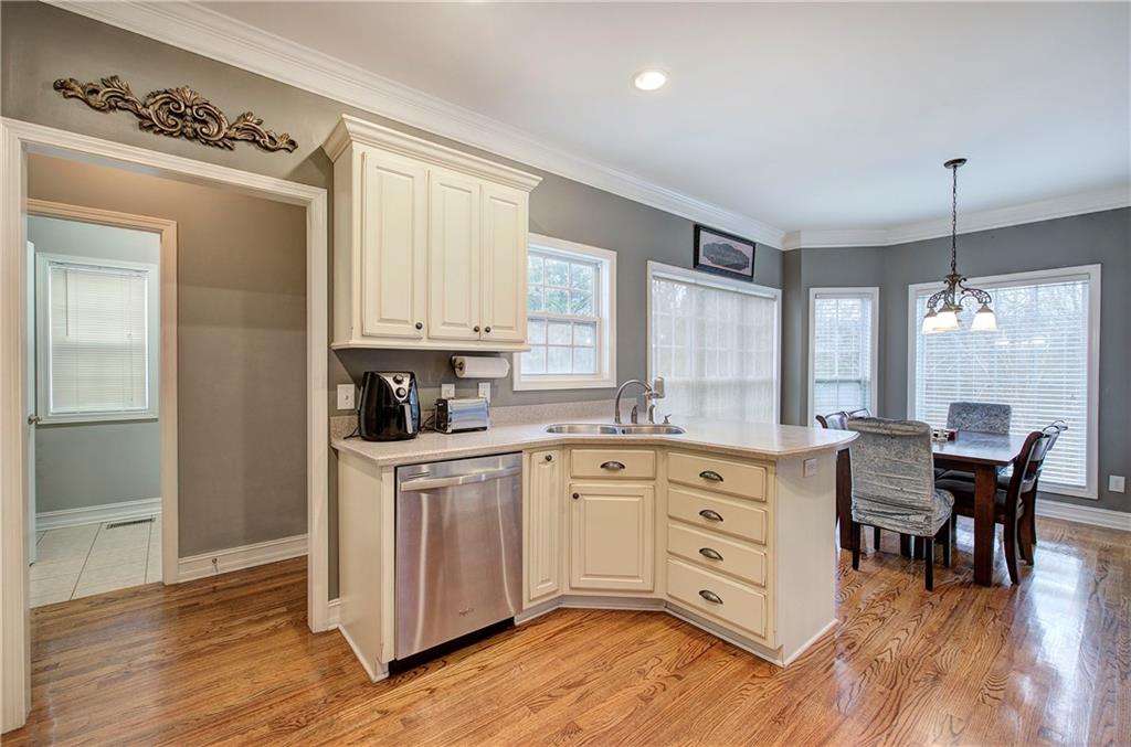 57 Colonial Circle Northwest Cartersville, GA 30120 - Photo 18 of 45 a kitchen with stainless steel appliances granite countertop a stove and cabinets