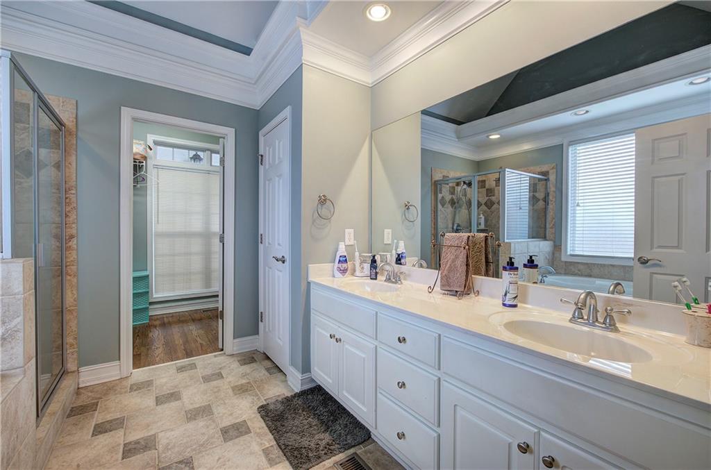 57 Colonial Circle Northwest Cartersville, GA 30120 - Photo 24 of 45 a bathroom with a sink double vanity and a mirror