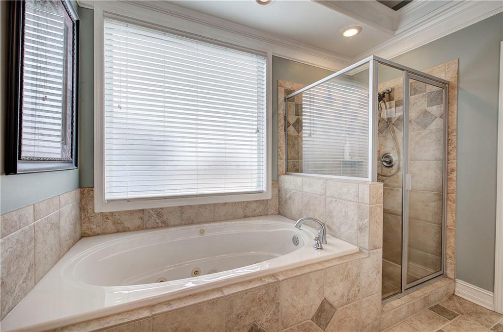 57 Colonial Circle Northwest Cartersville, GA 30120 - Photo 25 of 45 a bathroom with a bathtub and shower