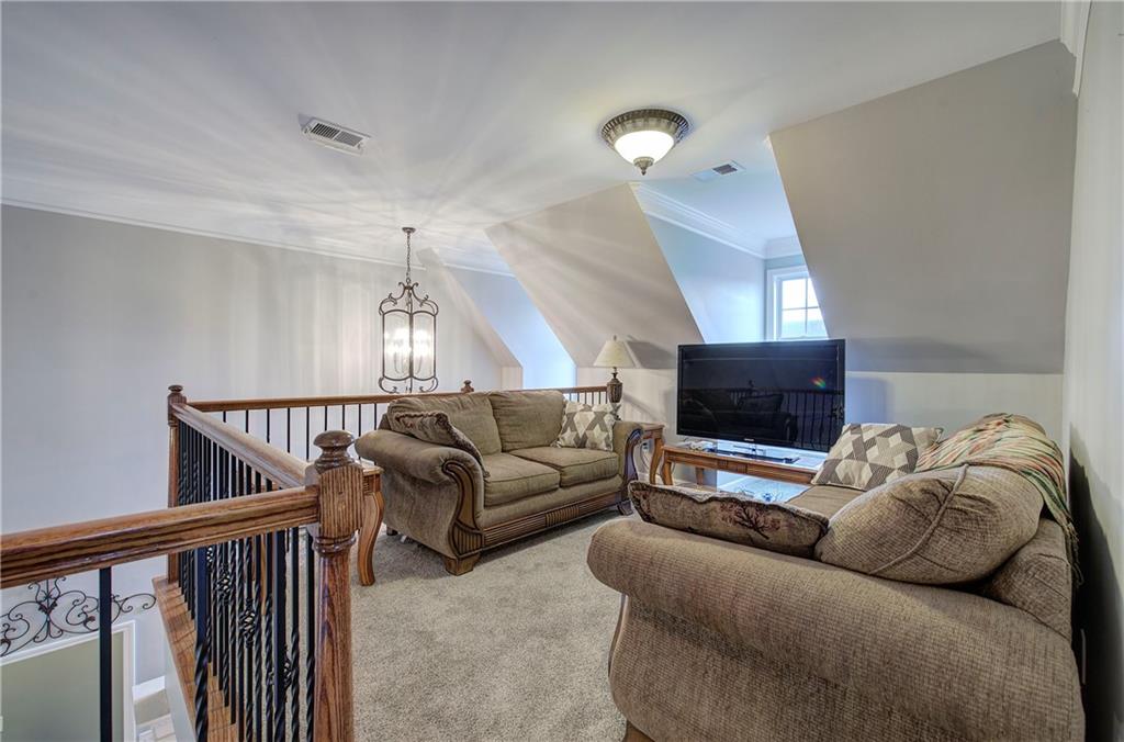 57 Colonial Circle Northwest Cartersville, GA 30120 - Photo 29 of 45 a living room with furniture and a flat screen tv