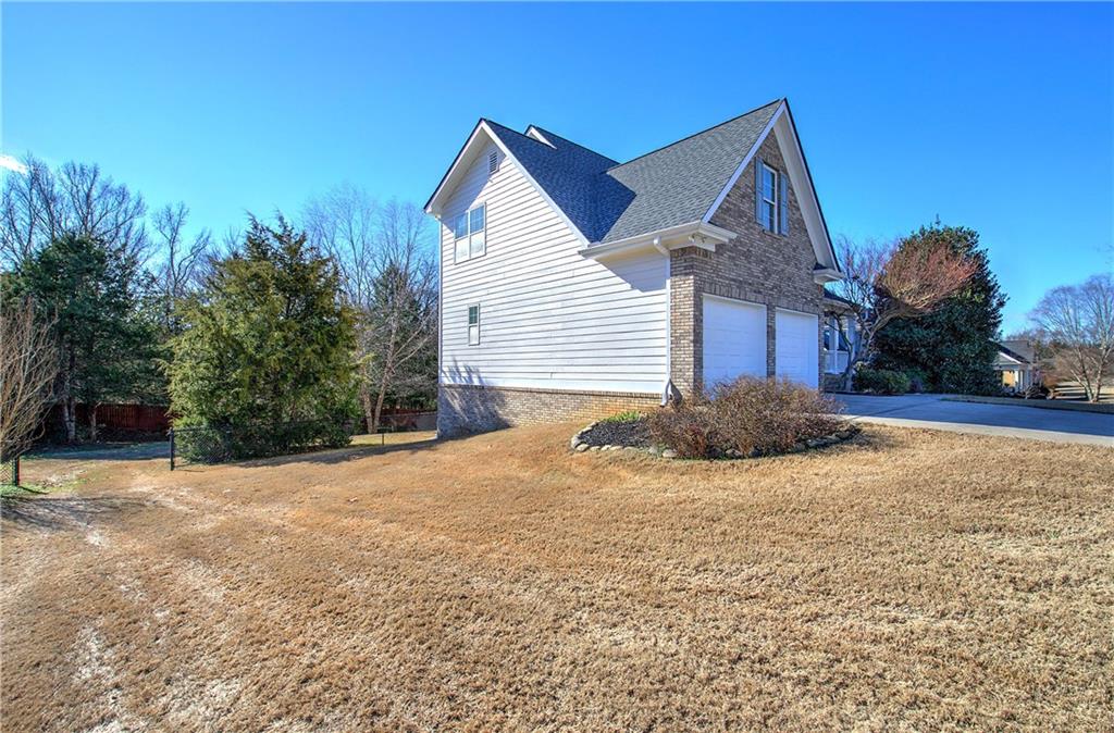 57 Colonial Circle Northwest Cartersville, GA 30120 - Photo 3 of 45 a view of a house with a yard and garage
