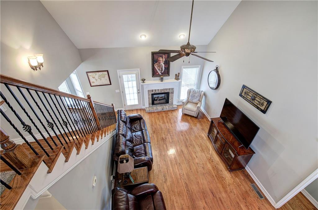 57 Colonial Circle Northwest Cartersville, GA 30120 - Photo 31 of 45 a living room with furniture a fireplace and a flat screen tv