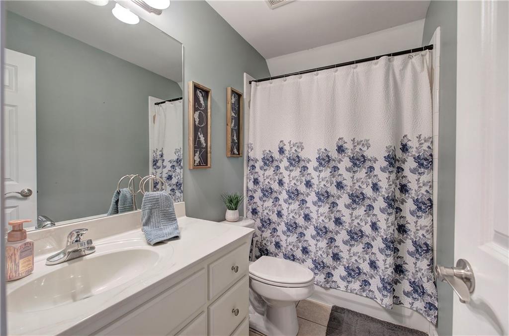 57 Colonial Circle Northwest Cartersville, GA 30120 - Photo 32 of 45 a bathroom with a toilet sink and mirror