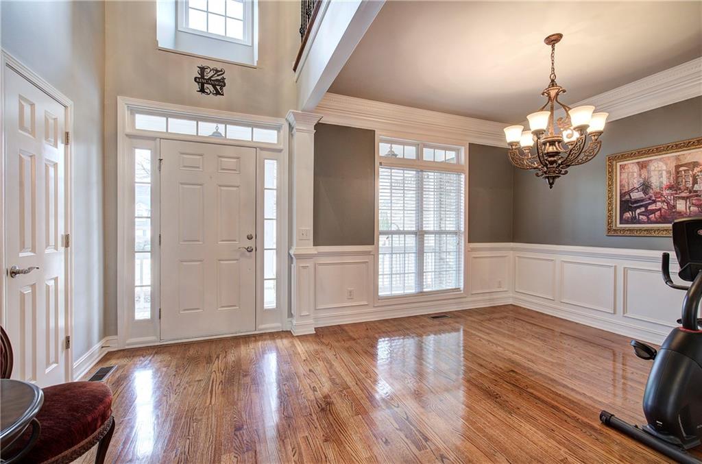 57 Colonial Circle Northwest Cartersville, GA 30120 - Photo 5 of 45 a view of an empty room with wooden floor and a window