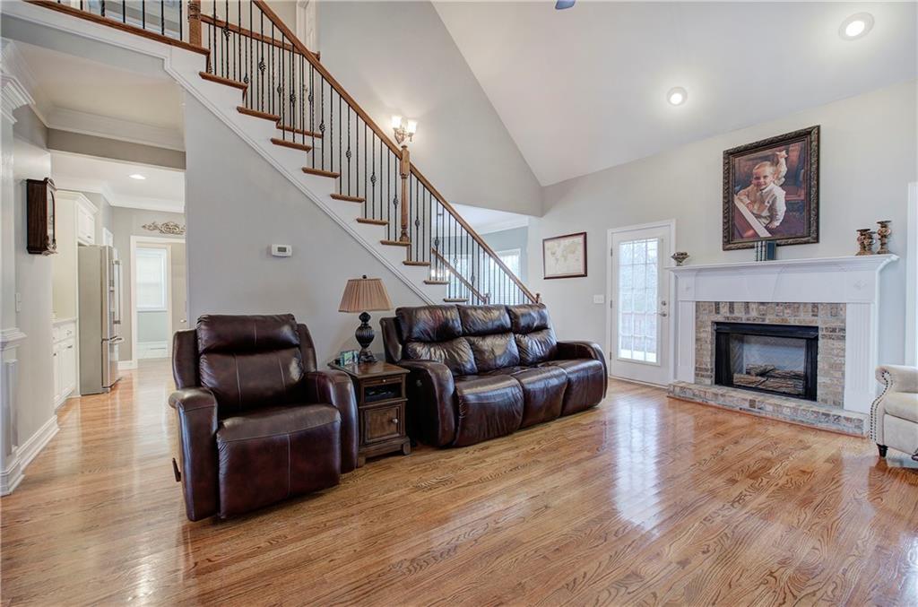 57 Colonial Circle Northwest Cartersville, GA 30120 - Photo 8 of 45 a living room with furniture and a fireplace