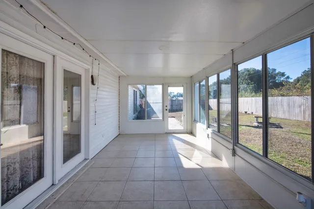 a front view of house with yard having swimming pool