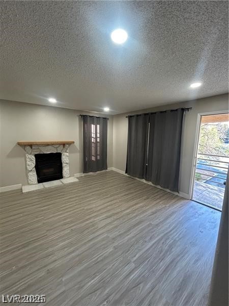 9070 Spring Mountain Road, Unit 210 Las Vegas, NV 89117 - Photo 3 of 12 This inviting living area features modern flooring and a classic stone fireplace.