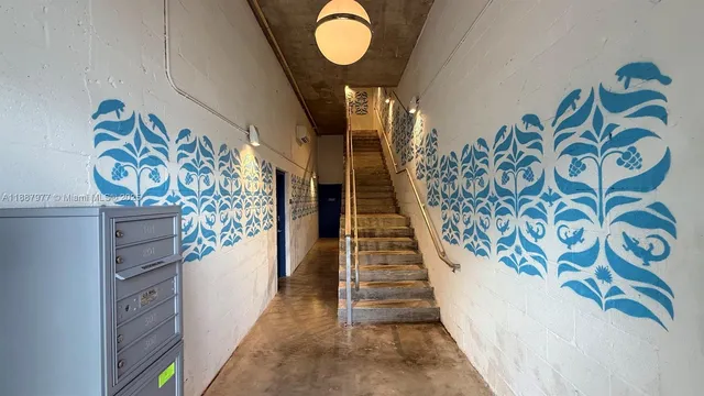 a view of entryway with stairs and wooden floor
