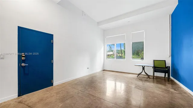 a view of workspace with furniture and window