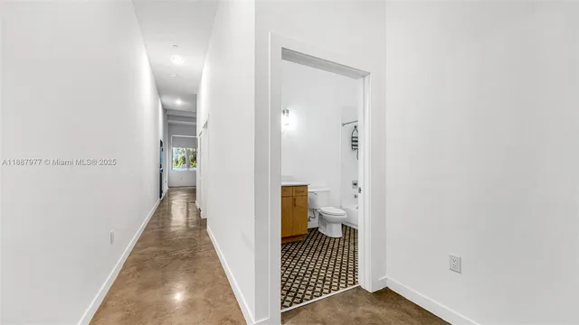 a view of a hallway with a room