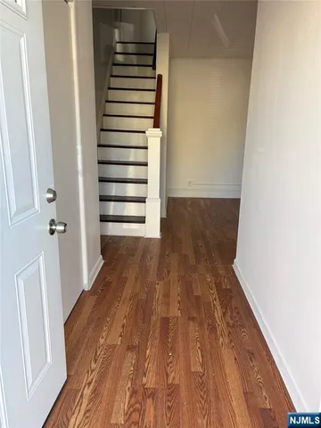 a view of entryway with wooden floor