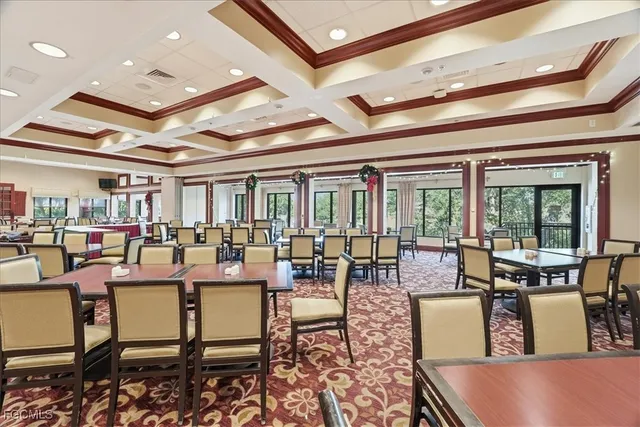 a living room with lots of furniture and a chandelier