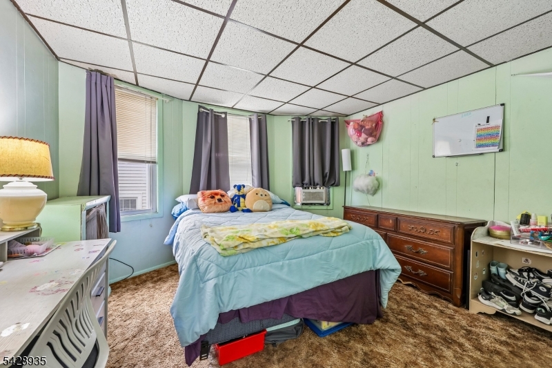 50 Preston Street Ridgefield Park, NJ 07660 - Photo 31 of 41 a bedroom with a bed a dresser next to a window