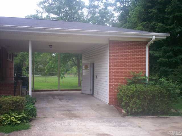 3320 Old Buffaloe Road Raleigh, NC 27604 - Photo 2 of 12 a view of a house with a backyard